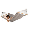 Beige and white spreader bar hammock