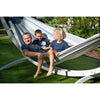 Family relaxing in hammock together