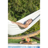 Woman enjoying the sun laying in a hammock
