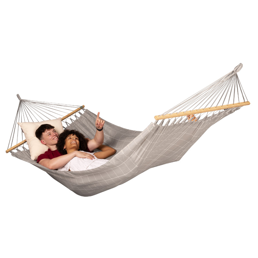 Couple in double spreader bar hammock