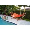 Hammock and stand beside pool