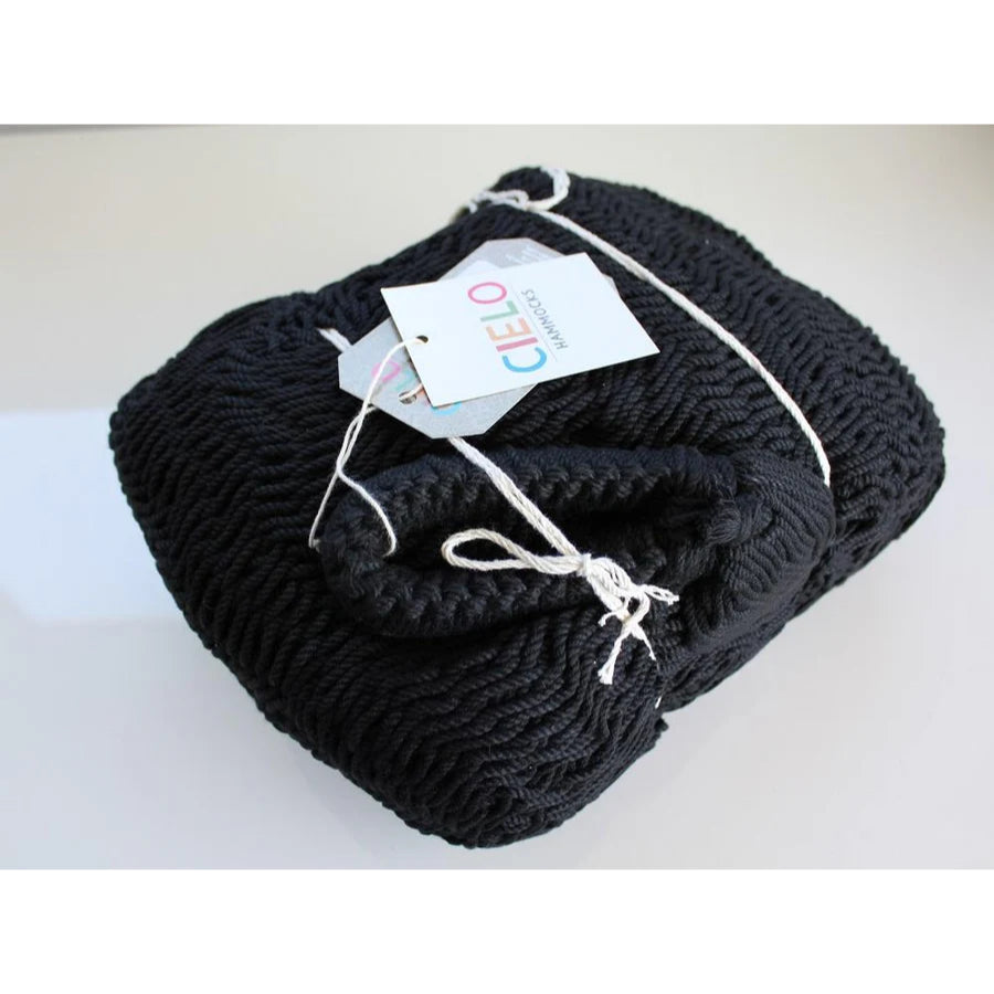 Folded up Mexican black polyester hammock