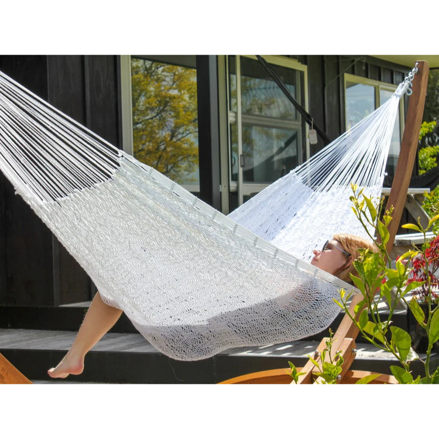 Mexican woven polyester hammock in white hung on deck