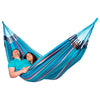 Couple relaxing in blue family size fabric hammock