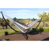 Arc hammock stand on deck with black and white Mexican made hammock