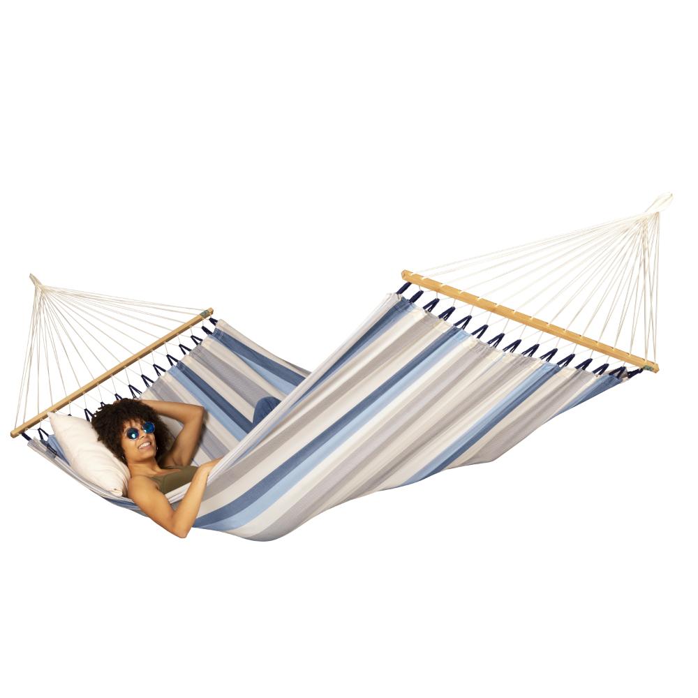 Black metal arc hammock stand with blue and white bar hammock