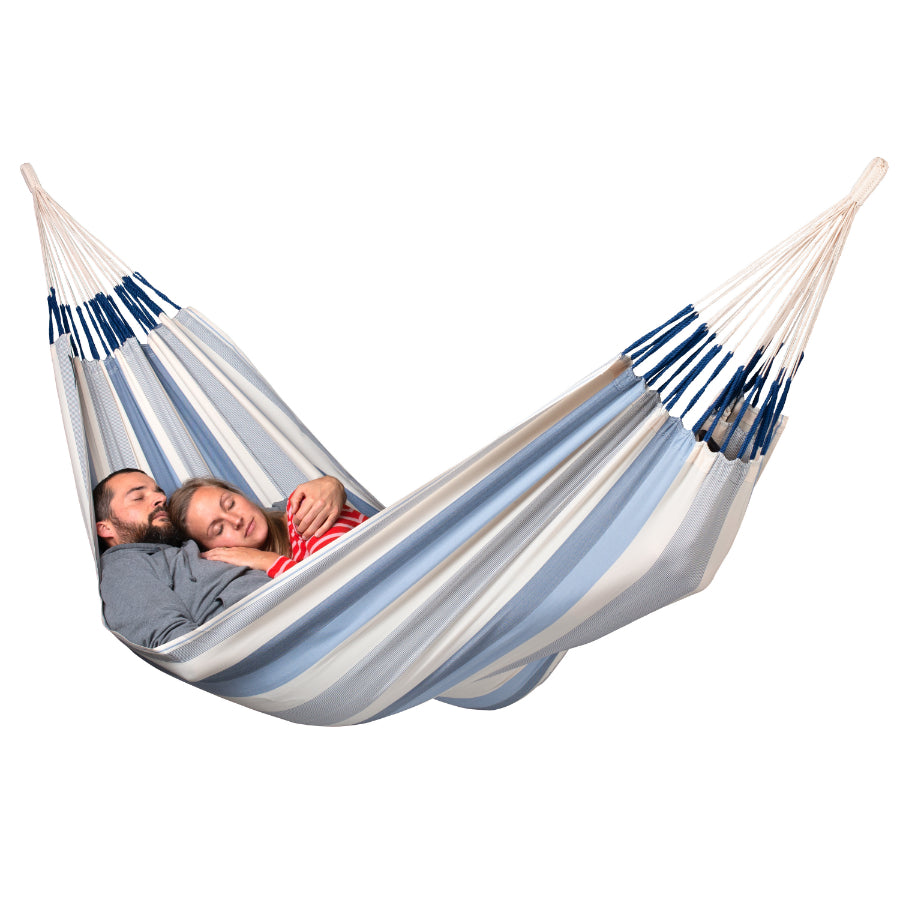 Two people sleeping in double hammock