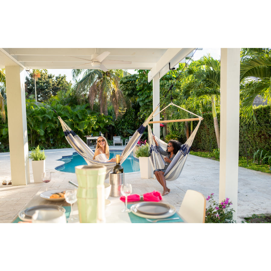 Hammocks hung in poolside outdoor area