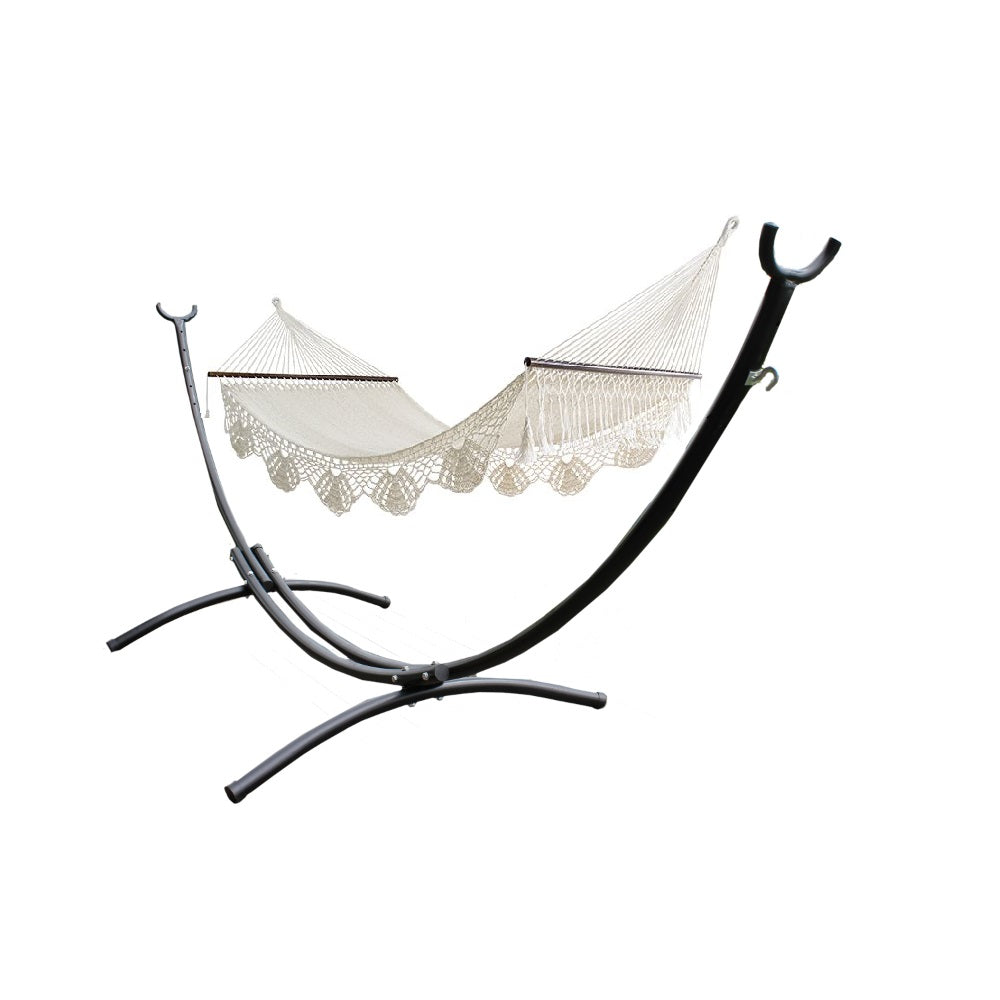 Black curved metal hammock stand and large white bar hammock