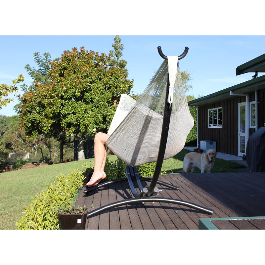 Off-white Cotton Mexican handmade hammock on metal arc frame on deck