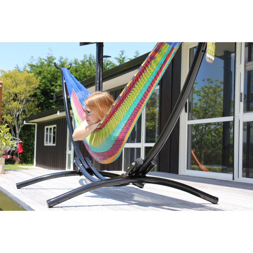 Curved Black metal stand and off white Mexican hammock