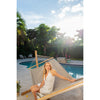 hammock on wooden stand beside swimming pool on summers day