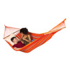 Two people relaxing in bright coloured hammock