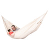 Two people sharing a white cotton hammock