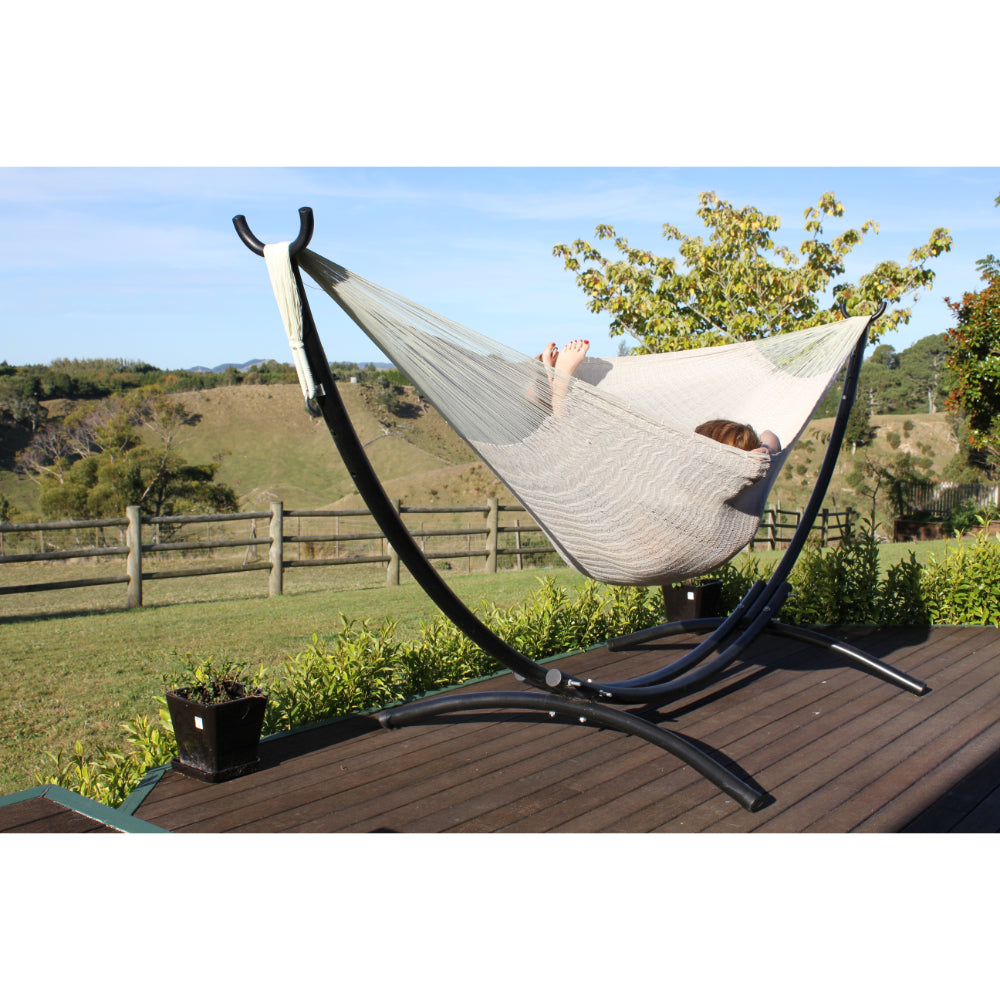 Metal arc hammock stand with woven Mexican hammock