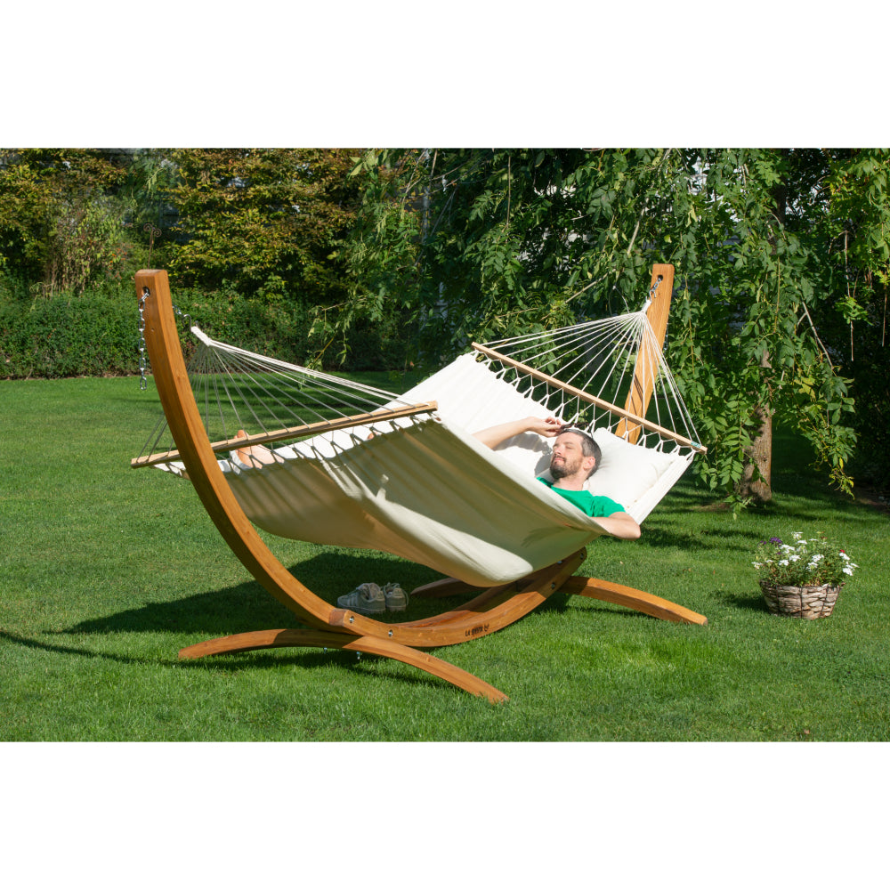 Curved wooden hammock stand outdoors in park